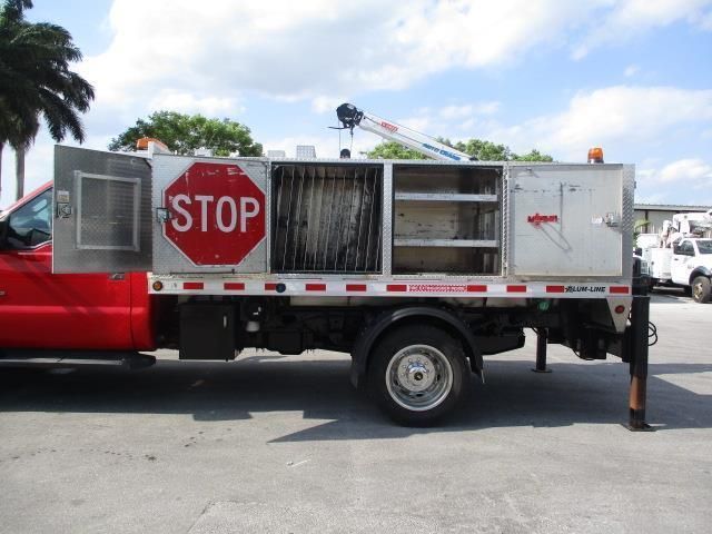 A red truck with a stop sign on the side