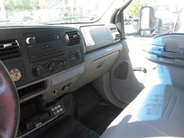 The interior of a ford truck with a steering wheel