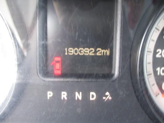 A close up of a car 's dashboard with the numbers 190392.2mi on it