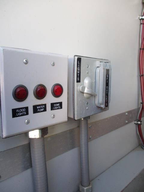 A white box with a red button that says flood lights