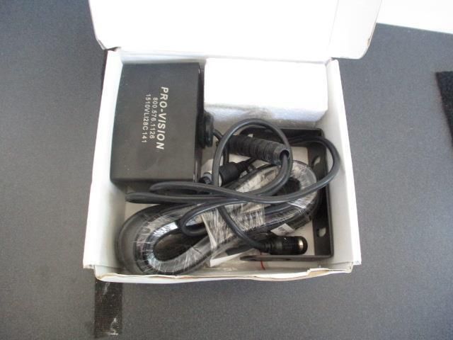 A pro-vision charger is in a white box