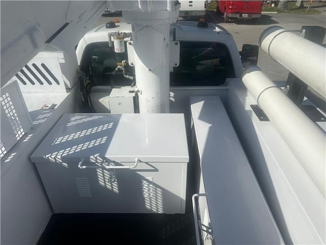 A white truck with a box in the back