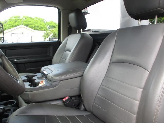 The interior of a dodge ram truck with gray leather seats