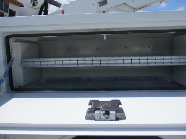 The inside of a white truck with the door open.