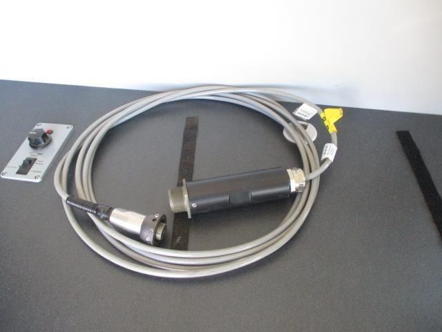 A cord with a handle is sitting on a table