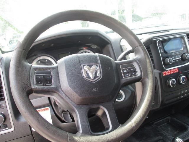 A close up of a steering wheel in a dodge truck