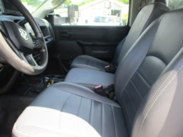 The front seats of a dodge ram truck are black and white