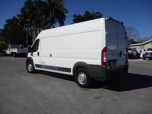 A white van is parked in a parking lot