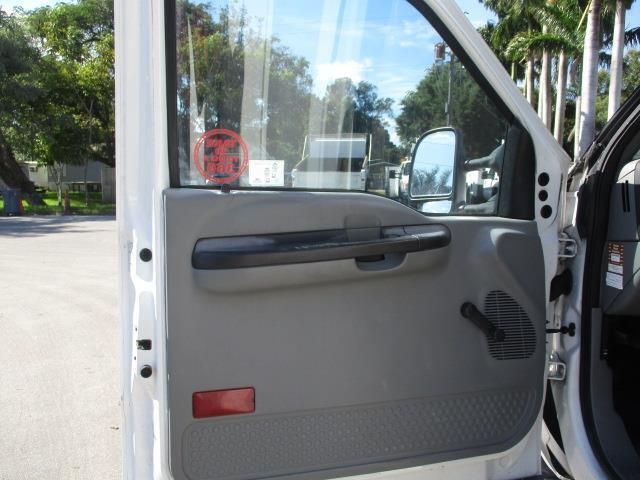 The door of a white truck with the door open