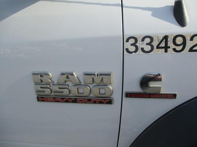 The side of a white ram 5500 heavy duty truck
