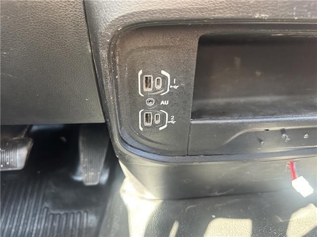 A close up of a car dashboard with a wireless charger.