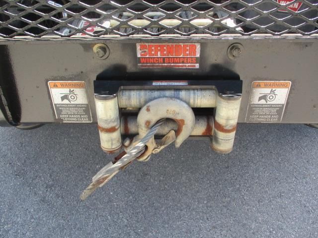 A close up of a winch on the back of a truck