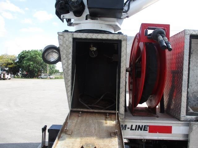 A m-line truck is parked in a parking lot
