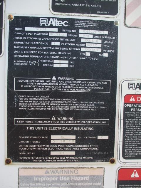 A black and white plaque with the word altec on it