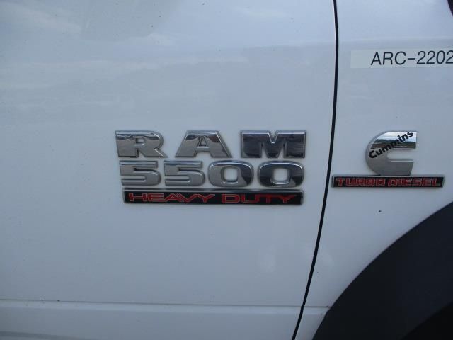 The side of a white ram 5500 heavy duty truck
