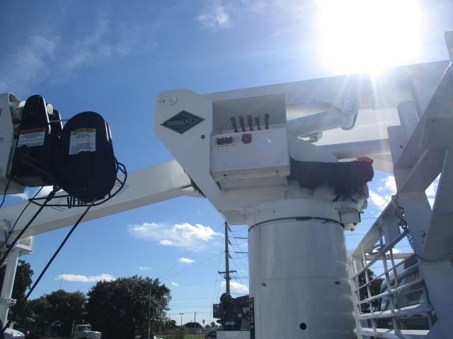 A white crane with a blue sky in the background