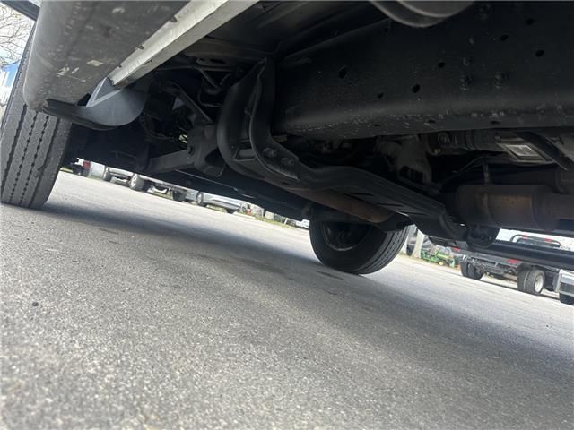 A car is parked on the side of the road.