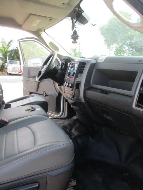 The interior of a dodge ram truck with the door open