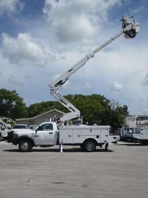 A white utility truck with a crane attached to it