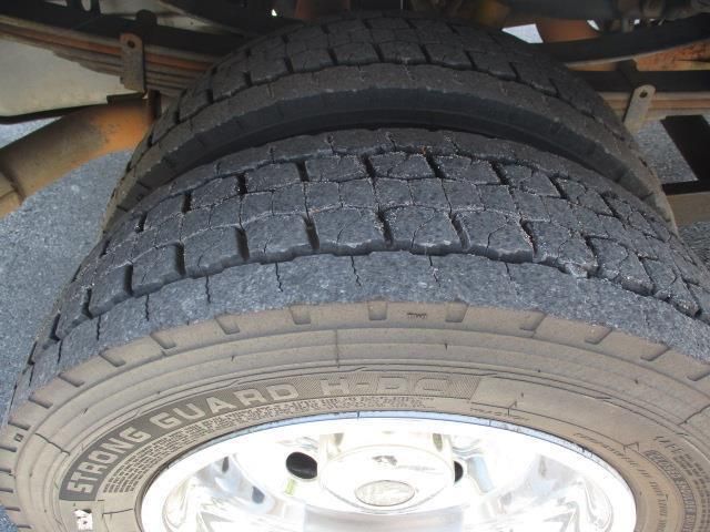 A close up of a tire that says strong guard on it