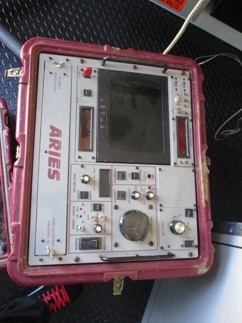 A pink case with aries written on it