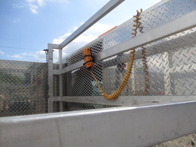 A metal fence with a rope attached to it
