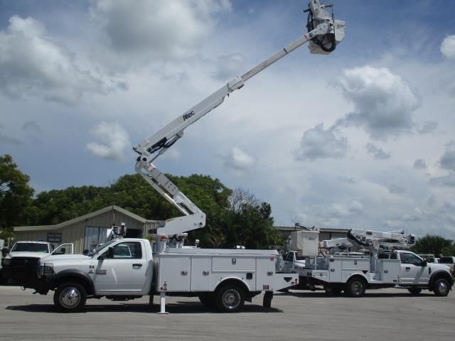 A utility truck with a crane attached to it