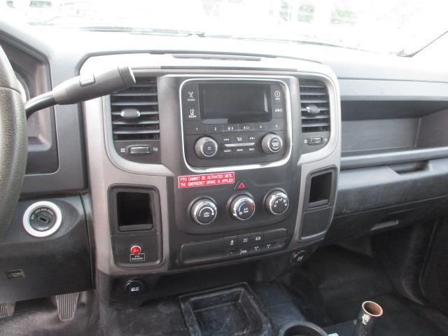 The interior of a dodge ram truck with a radio