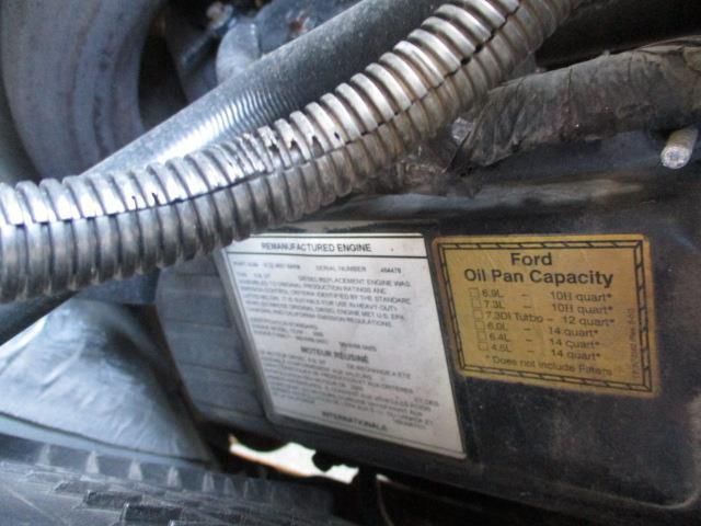 A close up of a ford oil pan capacity sticker