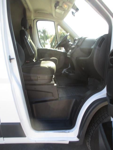 The inside of a white van with the door open
