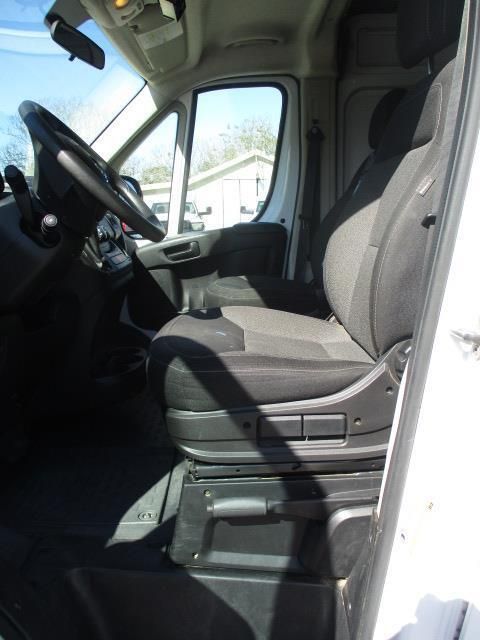 A white van with black seats and a steering wheel