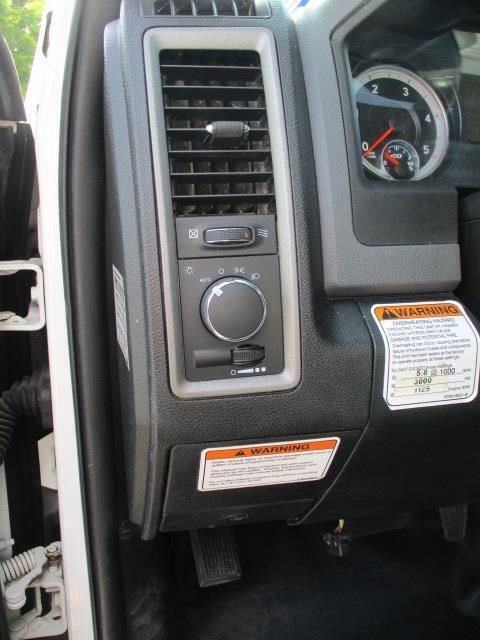 A dashboard with a warning label on it