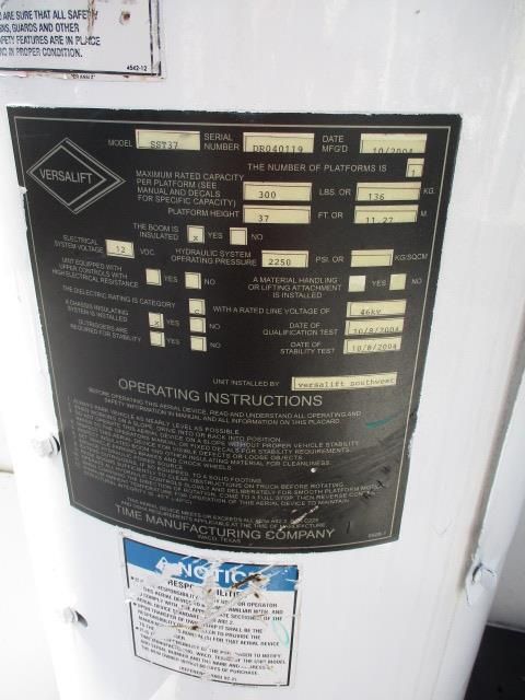 A white water heater with a black label that says operating instructions