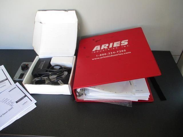 A red binder with the word aries on it