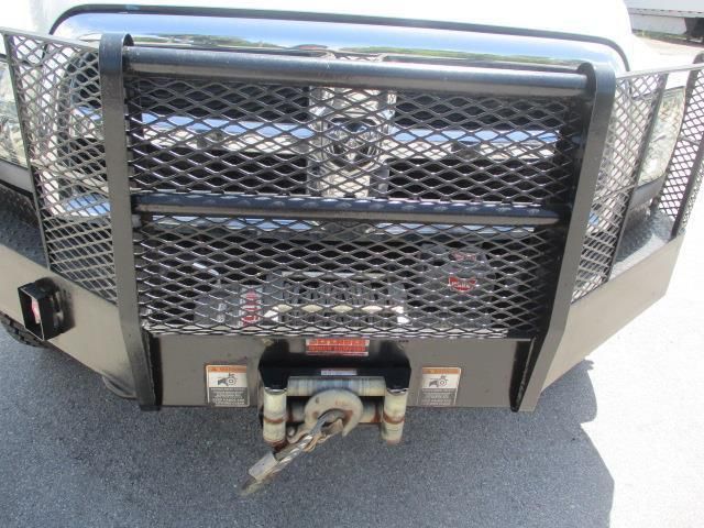 The front of a truck with a winch attached to it