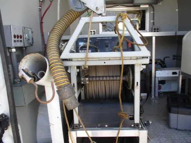 A machine with a large hose attached to it