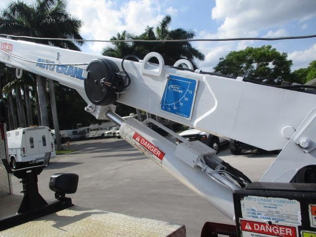 A white crane with a danger sticker on it