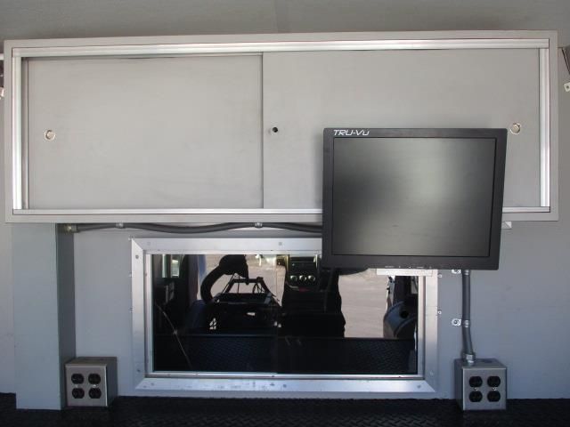 A flat screen tv is mounted above a window