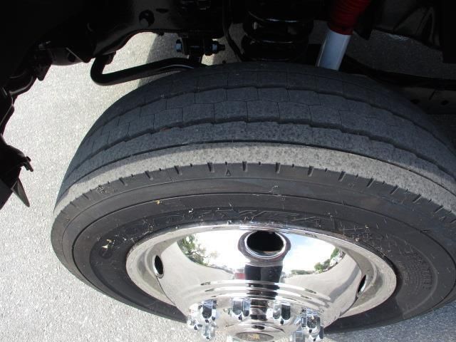 A close up of a tire with a chrome rim