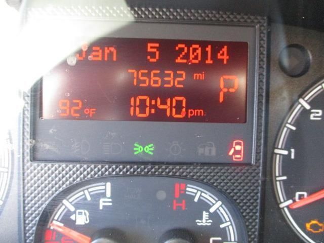 A close up of a car dashboard showing the date of january 5 2014