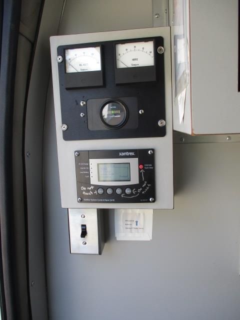 A gray box with a digital display on it