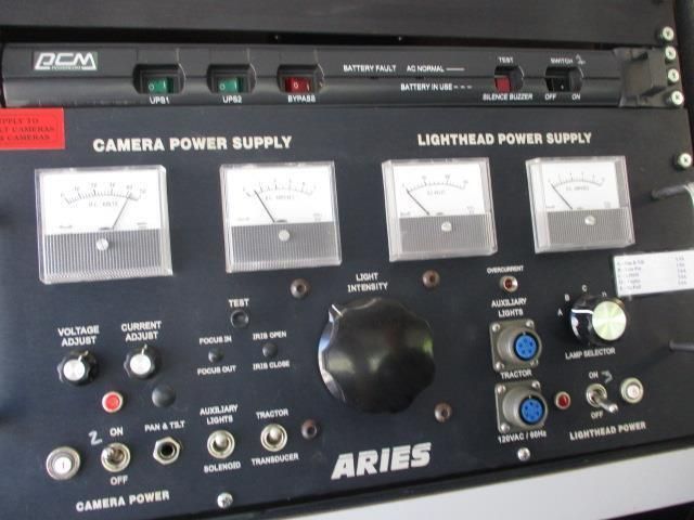 A camera power supply with aries written on it