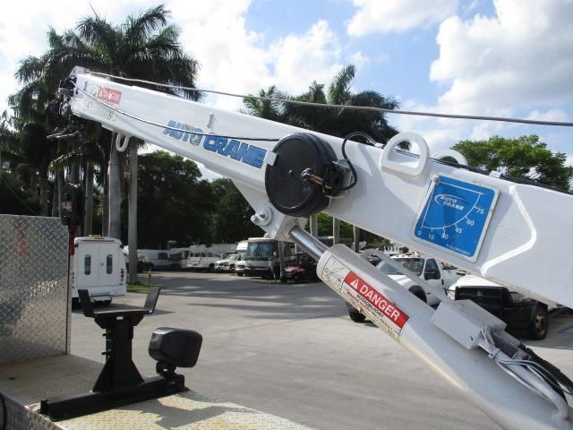 A white crane with a danger sticker on it