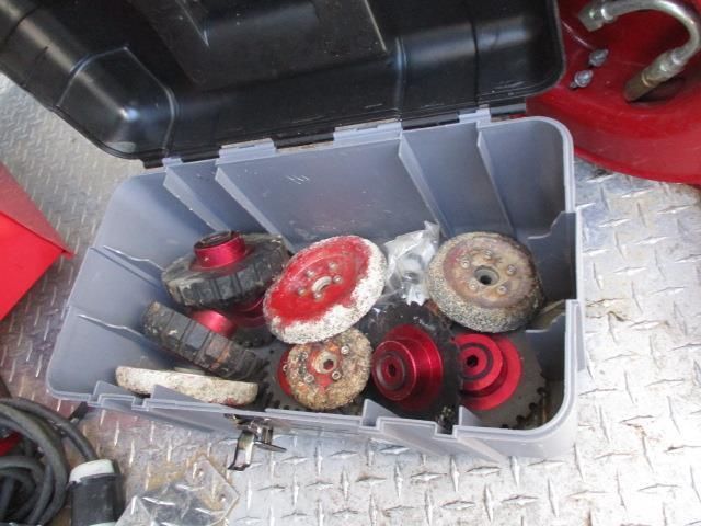 A toolbox filled with various tools and wheels