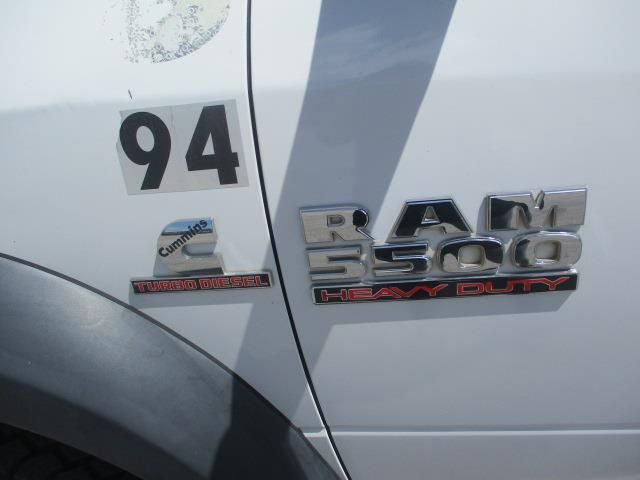 A white truck with the number 94 on it