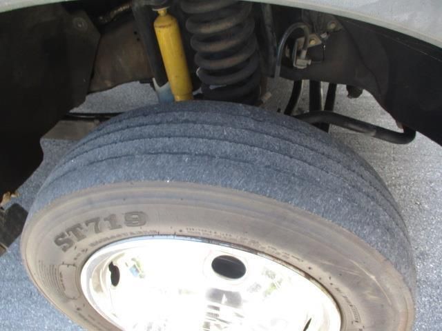 A close up of a tire that says st718 on it