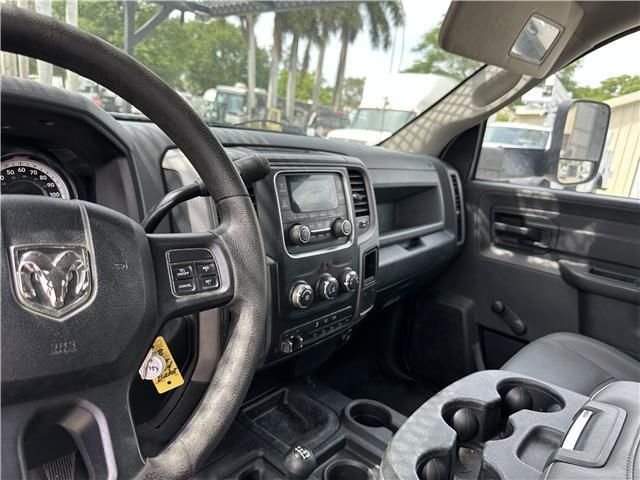 The interior of a dodge ram truck with a steering wheel