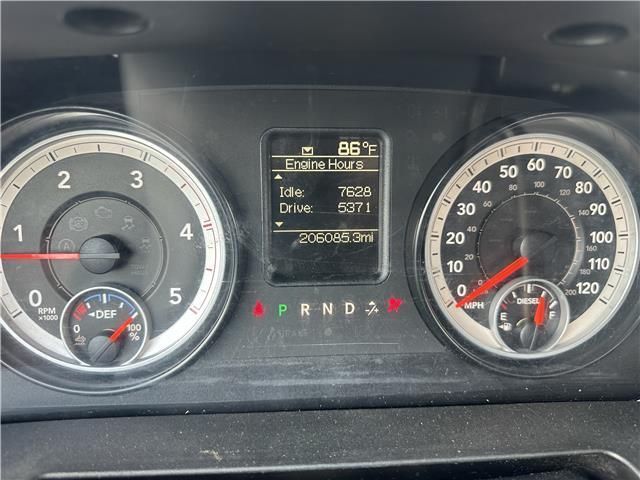 A close up of a car 's dashboard showing the temperature at 86 degrees