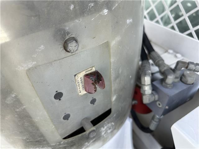 A close up of a metal object with a hole in it