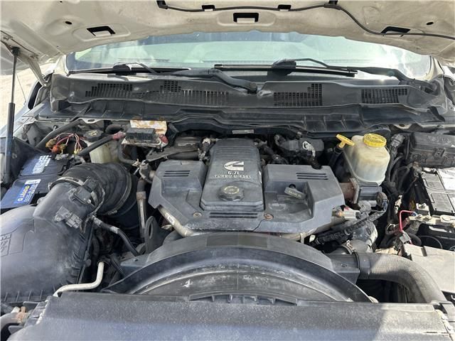 The engine of a dodge ram truck is shown with the hood up.